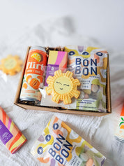 Boîte Rayon de soleil avec biscuit Meringue et confettis, chocolat Boréal, Flirt et C’est Bonbon