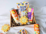 Boîte cadeau Rayon de soleil avec biscuit soleil, chocolat caramel et limonade clémentine québécoise